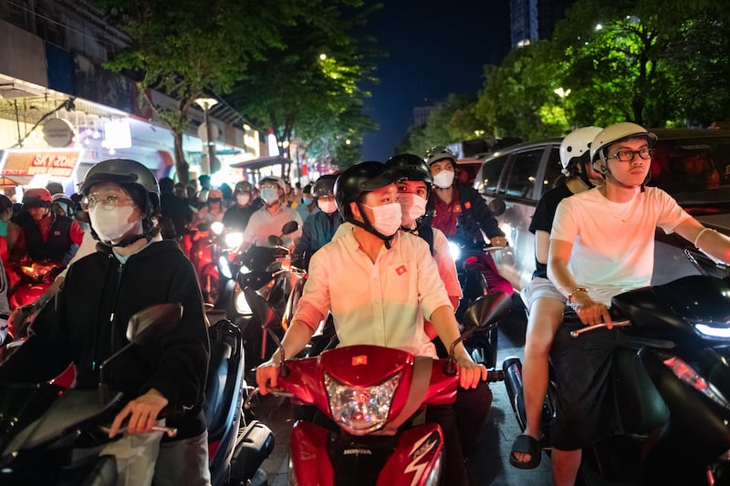 Motorbikes pass through the area where the parade marking the 50th anniversary of the end of the Vietnam war on April 30, 2025, in Ho Chi Minh City, Vietnam.